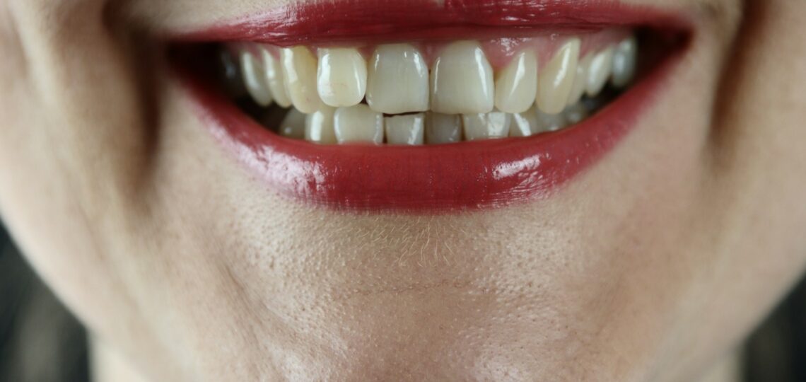 person with red lipstick and red lipstick